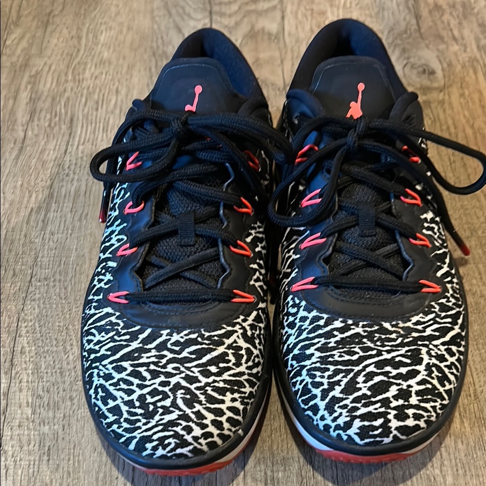 Black and White Patterned Sneakers with Red Accents